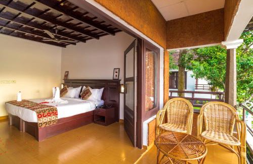 Nedumudy Resort | Cozy Warmth Lake Haven: Oceanfront Stay with Spa & Pool
