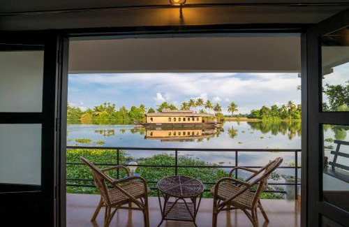 Nedumudy Resort | Cozy Warmth Lake Haven: Oceanfront Stay with Spa & Pool