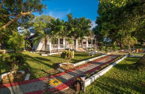 Nedumudy Resort | Cozy Warmth Lake Haven: Oceanfront Stay with Spa & Pool