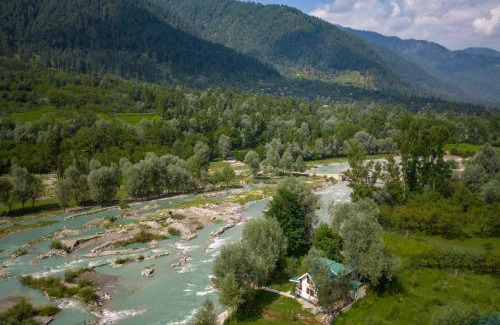 Gund Villa | Pet-Friendly StayVista at Water's Edge with River Views