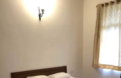 Guirim Villa | Inviting Water Villa with Field View and Family Amenities