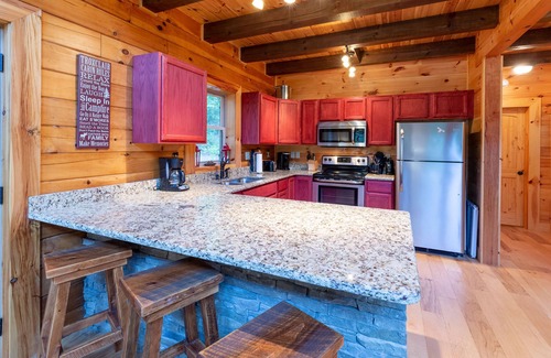 Tuckasegee Cabin | Serene Waterfall Hideaway: Streamside Cabin with Hot Tub