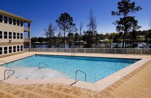 Foley Condo | Waterfront Retreat: Fishing, Pool Access & Close to Outlets