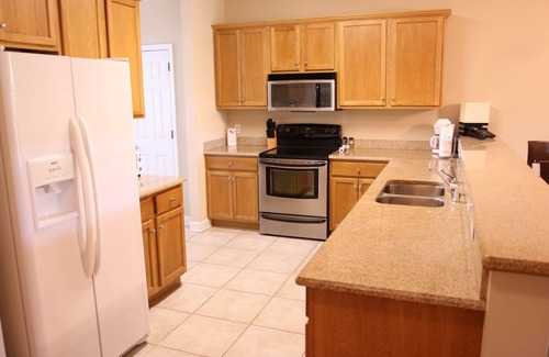 Foley Condo | Tranquil Waterfront Retreat: Fishing, Pool & Close to Outlets