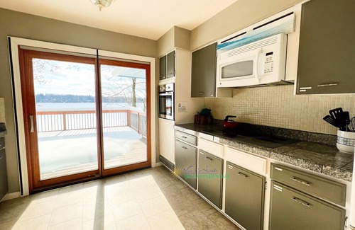 Interlochen House | Waterfront Retreat Near Interlochen with Pool & Breakfast