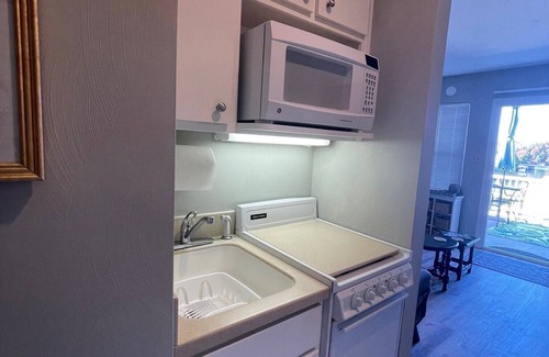 North Shore Condo | Inviting Waterfront Retreat: Family-Friendly with Pool & Breakfast