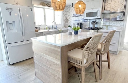 Brewster House | Idyllic Waterfront Retreat with Private Beach & Bikes