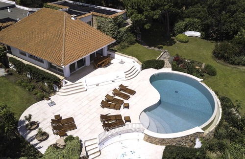 San Teodoro Villa | Scenic Waterfront Retreat with Beach Access and Ocean Views