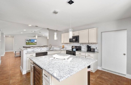 Palm Harbor House | Waterside Pool Paradise: Oceanfront Retreat with Spa