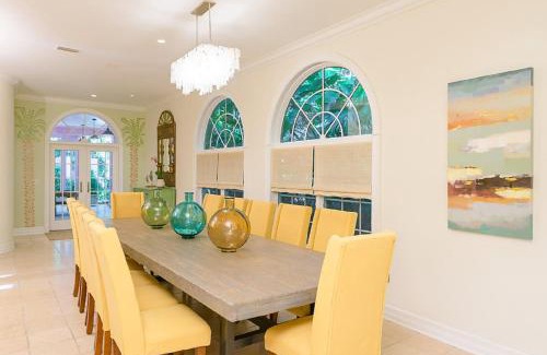 Captiva House | Inviting Waterfront Pink House with Private Dock and Pool