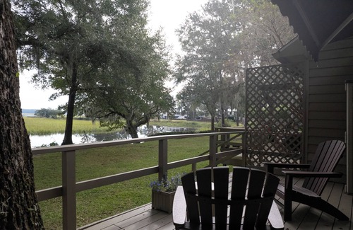 Pine Harbor House | Waterfront views of the beautiful Sapelo river from the living room and porch!