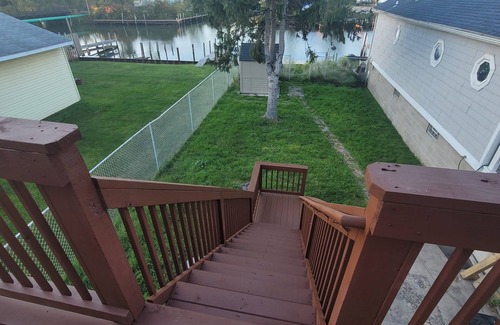 Wyandotte House | Waterfront with boat dock 3-bedroom house on Detroit River canal. Good for 8