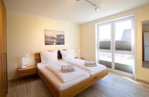 Wittduen Apartment | Accessible Retreat at Weiße Düne Ferienwohnung