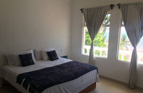 Xcalak Hotel | Discover the Flying Cloud Beach Hotel: Oceanfront Relaxation