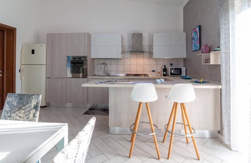 Nurachi Apartment | Discover Welcomely - Family-Friendly Mameli Apartment