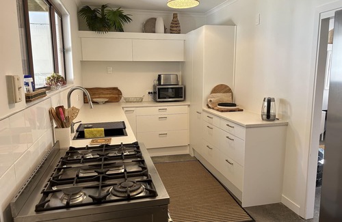 Te Akau House | West Coast Retreat - Pet-Friendly Getaway with River Views