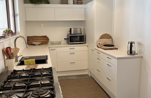 Te Akau House | West Coast Retreat - Pet-Friendly Getaway with River Views