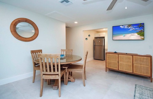 Tradewinds Cottage | Oceanfront Bliss: West End Paradise Suite with Water Views