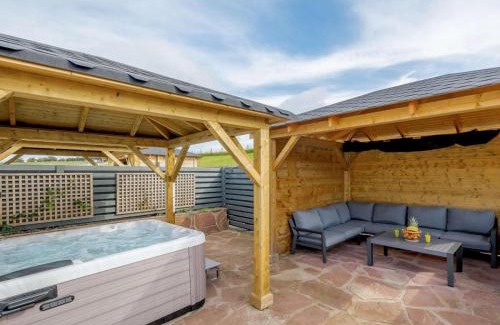 Alexandria House | Westertonhill Lodge: New Build with Hot Tub & Family Amenities