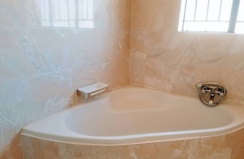 Mount Hampden Apartment | Discover WestPoint Quays: Family-Friendly with Pool Access