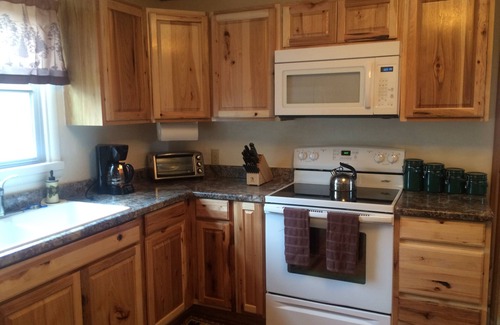 Georgetown Cabin | Family-Friendly Whispering Pines Cabin with Hot Tub & Lake Views