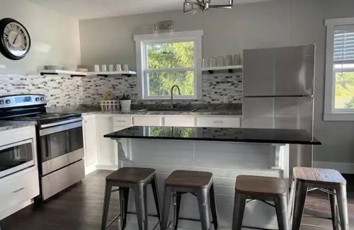 Gladwin House | Relax at Whispering Pines Lake House with Ocean Views
