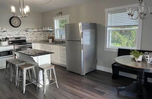 Gladwin House | Relax at Whispering Pines Lake House with Ocean Views