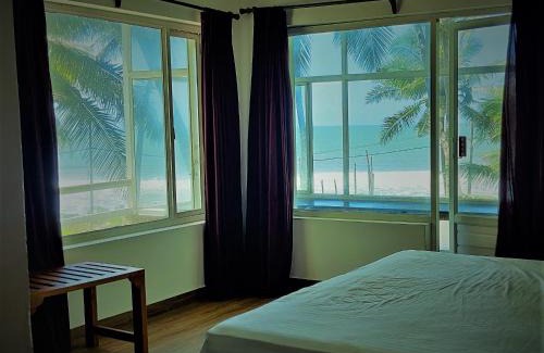Kannur Resort | Oceanfront White Shell Beach House with Breakfast Included