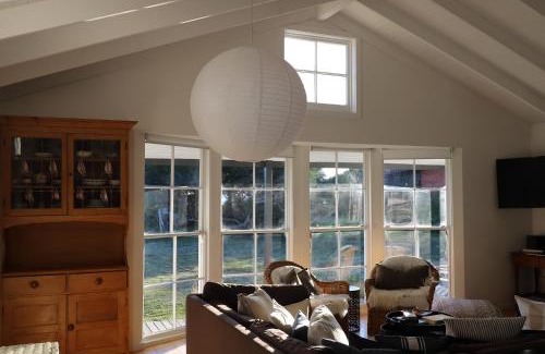 Falmouth House | Beachfront White Shell Cottage with Ocean Views & Firewood