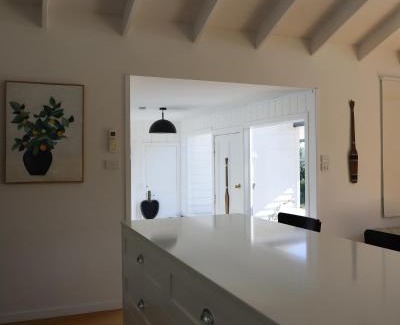 Falmouth House | Beachfront White Shell Cottage with Ocean Views & Firewood