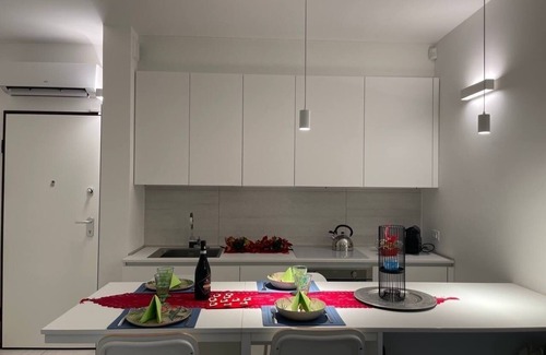 Lido di Jesolo Apartment | Cozy White Suite by the Sea with Ocean Views and Spa