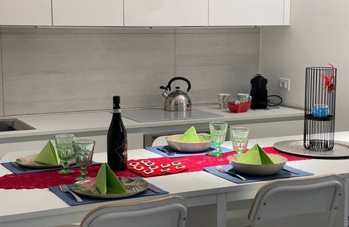 Lido di Jesolo Apartment | Cozy White Suite by the Sea with Ocean Views and Spa
