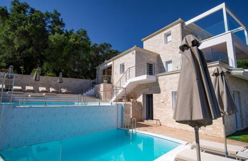 Anthousa Villa | Discover White Villas: Oceanfront Oasis with Pool Access