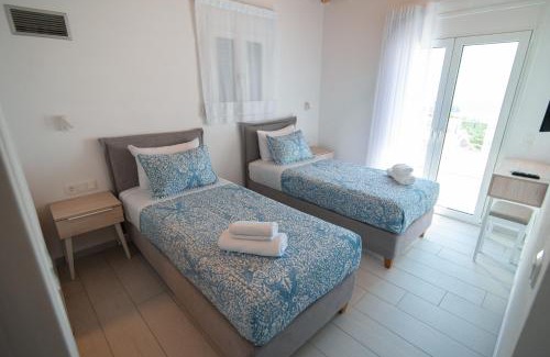 Anthousa Villa | Discover White Villas: Oceanfront Oasis with Pool Access
