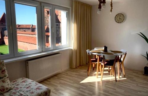 Malbork Apartment | Morning Views of the Castle with Family-Friendly Comfort