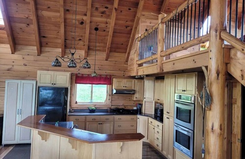Alpine Cabin | Experience Wild Wind Lodge: Woodwork & Scenic Views Await