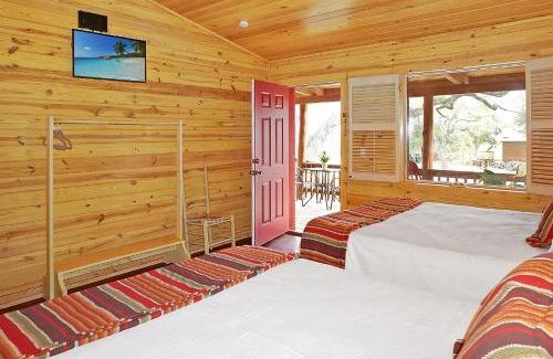 Wimberley House | Inviting Wimberley Log Cabins Resort with Pool & Family Fun