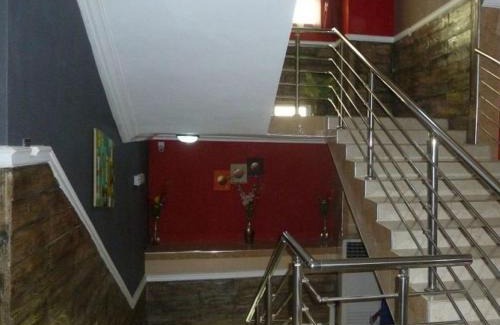 Asaba Cabin | Relaxing Room at Wise Penny Suites and Spa with Pool Access