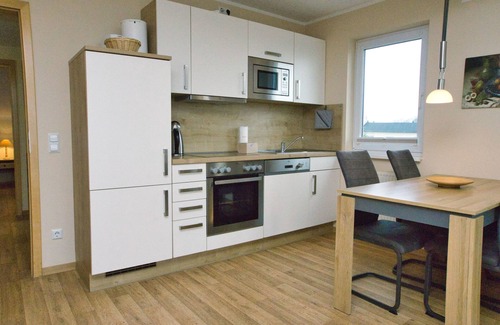 Gohren Apartment | Inviting Sea View Apartment with Pool and Sauna Access