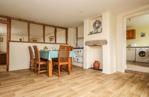Helford Passage Cottage | Family-Friendly Withan Farm Wing: Cozy Fire & Kitchen Amenities