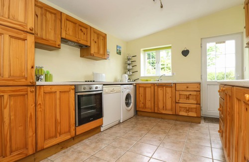 Helford Passage Cottage | Family-Friendly Withan Farm Wing: Cozy Fire & Kitchen Amenities