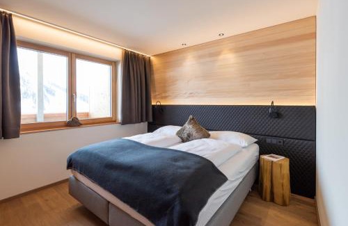 Warth Apartment | Wolfegg Appartement: 4-Star Haven with Café & Spa