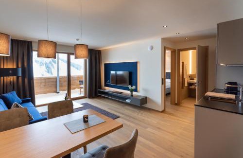 Warth Apartment | Wolfegg Appartement: 4-Star Haven with Café & Spa