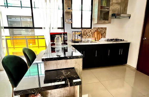 Puebla Apartment | Wonderful view, wooded road and shopping plaza across the street.