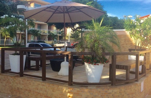 Porto das Dunas Apartment | Inviting Apartment Steps from Beach Park with Ocean View