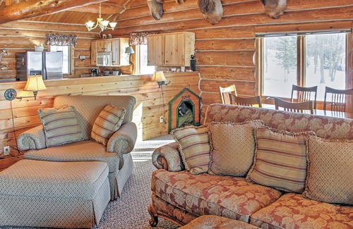 Oslund House | Beautiful Sand Lake Retreat with Expansive Porch & Spa