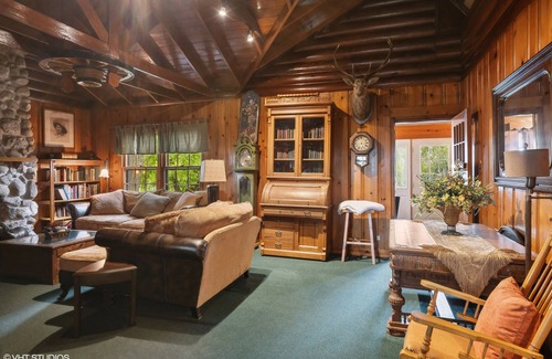 Antioch House | Inviting Waterfront Log Home at Chain o' Lakes with Pier