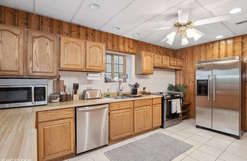 Antioch House | Inviting Waterfront Log Home at Chain o' Lakes with Pier