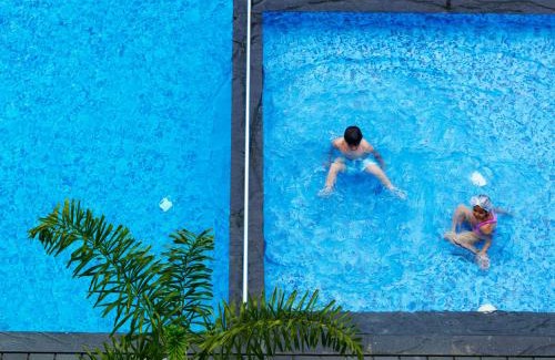 Bidadi Resort | Discover Wonderla Resort: Oceanfront Stay with Pool Access