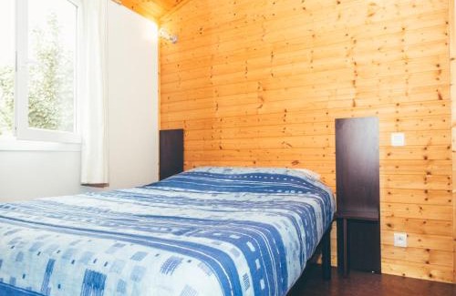 Beynat Ski Chalet | Idyllic Wooden Chalet by the Lake with Covered Terrace